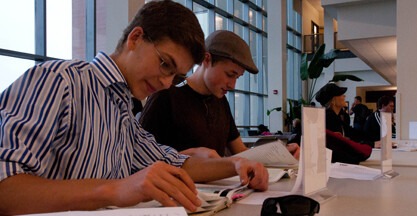 Students working at table in lobby