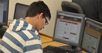 Student working on a desktop computer