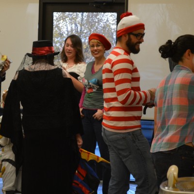 Group of students dressed up in costume at the Halloween party.