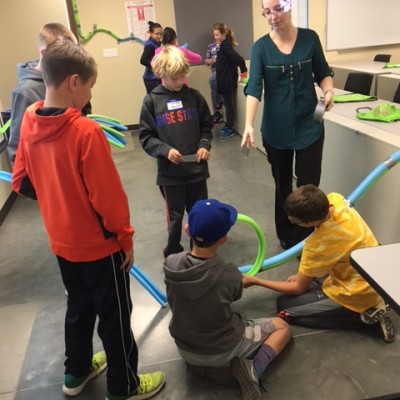 Students in classroom at STEM out building rollercoasters