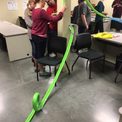 Students in classroom at STEM out building rollercoasters