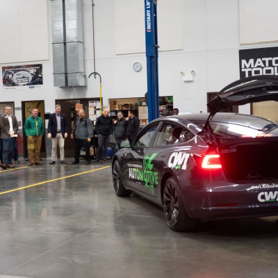 A new Tesla vehicle plays an automated light and sound show in front of an audience.
