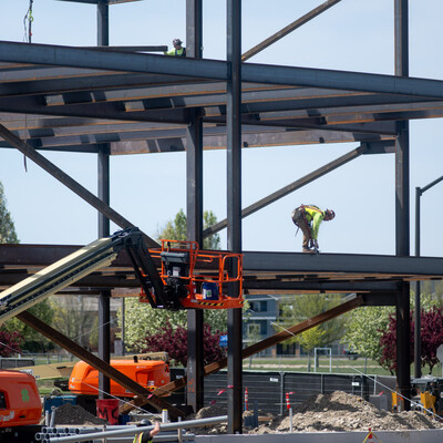 Construction workers work to complete a new building on the Nampa Campus of College of Western Idaho.