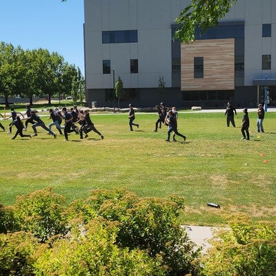 Group of people paying tag outside