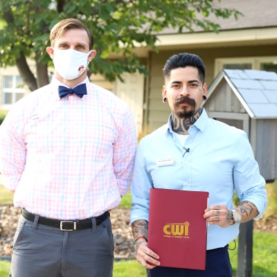 Patrick Tanner, CWI Assistant Vice President of Enrollment and Student Services, with Luis Granados