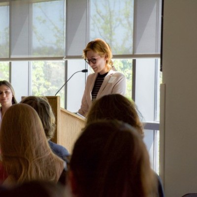 Woman speaks during Medical Professionals Club panel discussion