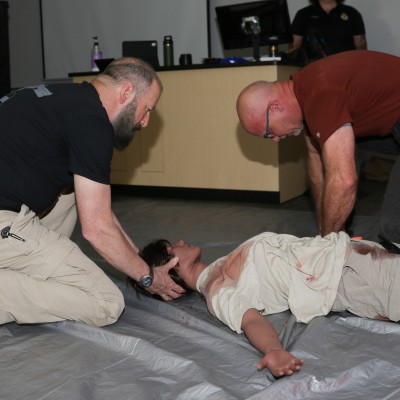 Instructors training with a mannequin