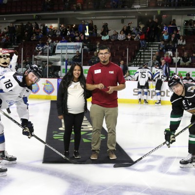 Puck drop by Edna, left, and Miguel Ramirez during CWI Night at the Idaho Steelheads