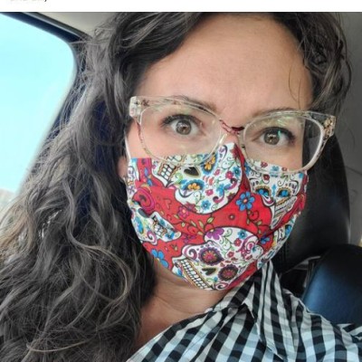 Associate Professor of Spanish, Amy Vassar, making lemonade with a discipline-appropriate mask