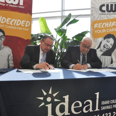 Title - Idaho State Treasurer Ron Crane (left) and College of Western Idaho President Bert Glandon (right) sign an agreement between CWI and the IDeal-Idaho 529 College Savings Program. 