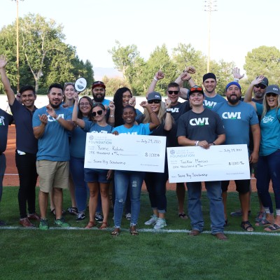 Two, $1,000 SCORE Big Scholarships were presented to students on the field during the game.