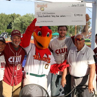 Hawks mascot presents check to members of CWI leadership