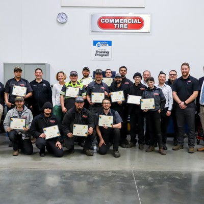 Faculty, Commercial Tire students and employees in a CWI auto lab