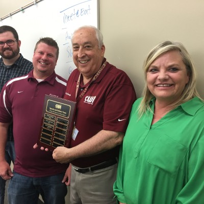 CWI President Bert Glandon (middle right) was honored for his support of Speech and Debate.