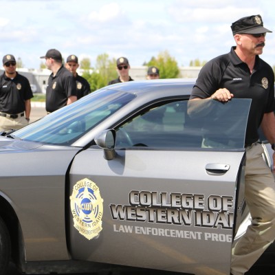 Reid exiting a CWI Law Enforcement vehicle