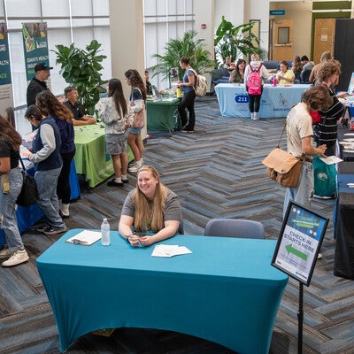 People visiting different booths and tables