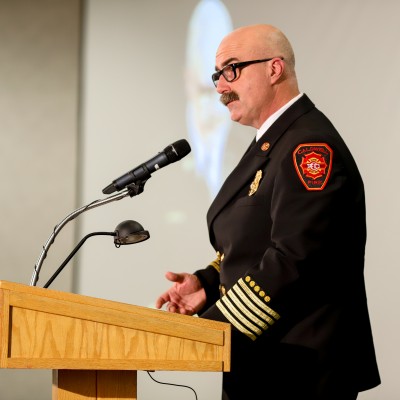 Chief Richard Frawley of Caldwell Fire Department speaking at graduation ceremony