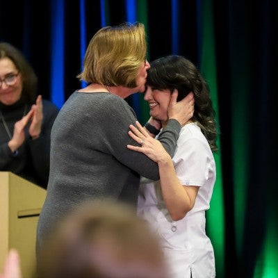 Student and family member celebrating completion of program