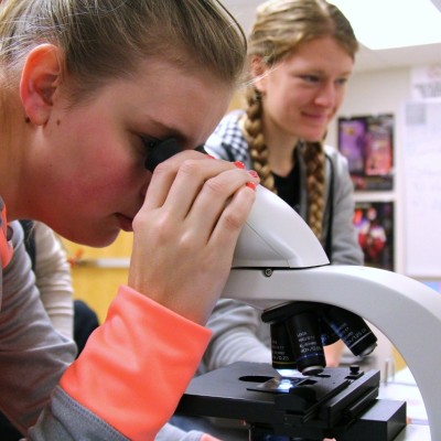 Students at microscope.