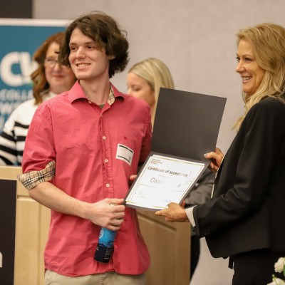 Apprentice student holding a certificate