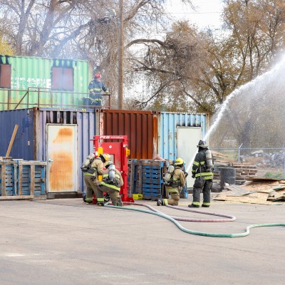 Students controlling hose
