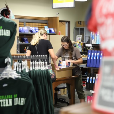 College of Western Idaho Bookstore staff helping student rent textbooks