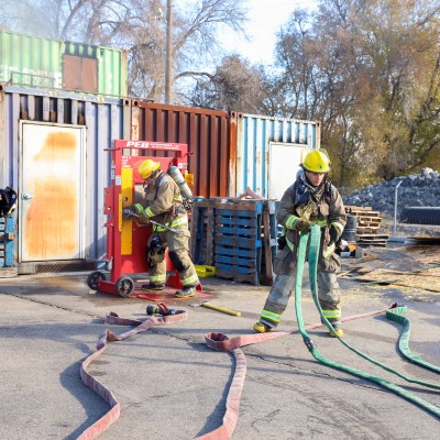 Students with hoses practicing Burn Day drills