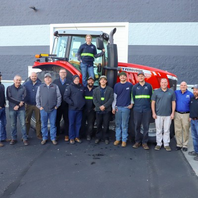 Donated tractor with students, staff and leadership
