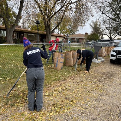 Law Enforcement officers and students working in a lawn