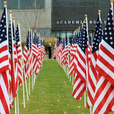 Multiple american flags in a ling on CWI lawn