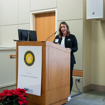 Student speaking behind a podium