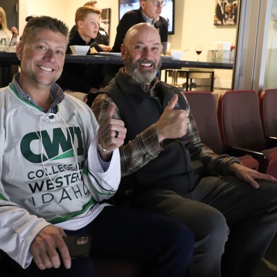 CWI Foundation Board members, Ben Chaney and Mike Peña, enjoying the game from the CWI suite