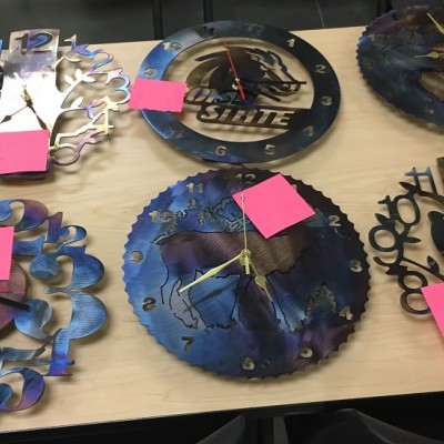 Kid's metal clocks they helps create in the Welding class during STEM out