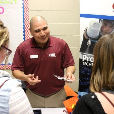 CWI staff member visiting with future CWI students