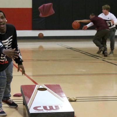 Future CWI students playing cornhole during CWI Day at Frank Church High School