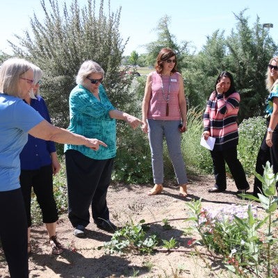 Friends gather to celebrate Joyce Bair at the Nampa Campus Academic Building.