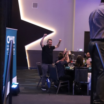 Man cheering after auction win