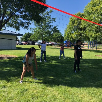 Students and staff playing volleyball at Carne Asada en el Parque Wednesday, June 19, 2019.