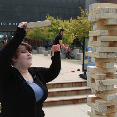 Student playing game in front of NCAB 