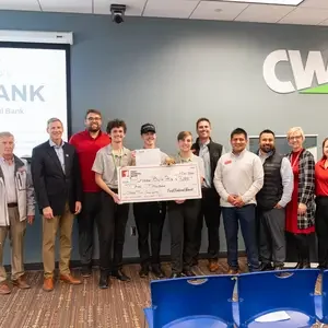 Winners with a giant check 