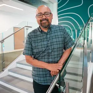 Alex Nava on a staircase