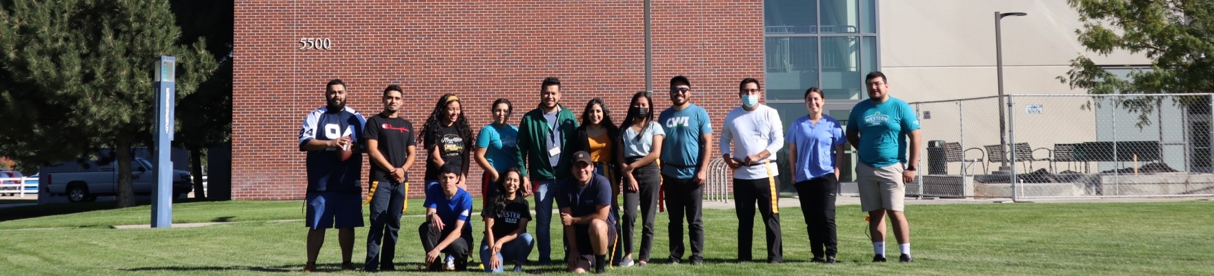 Latinx students standing for a picture. 