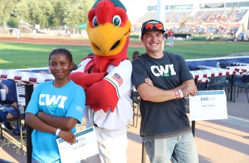 Students with scholarship certificates at CWI Night at the Boise Hawks
