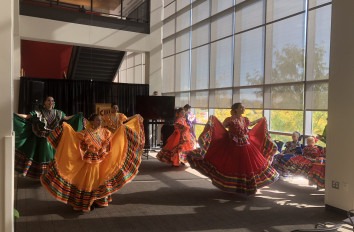 Women dancing traditional Mexican dance. 