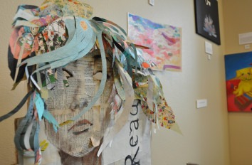 Multimedia art of female face in art gallery.