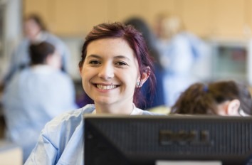 Happy medical student in classroom