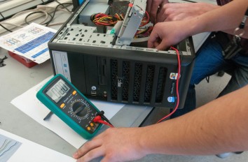 Healthcare IT students testing hard drive
