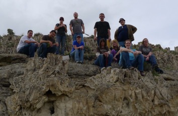 Group of students at top of rock formation.