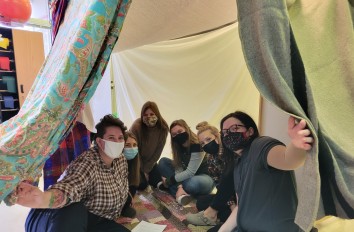 Occupational Therapy Assistant students constructing a blanket fort 
