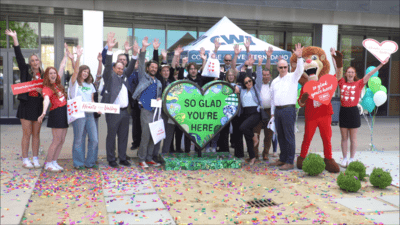 Group of faculty, staff, and CBH representative at CBH Homes Hearts Across the Valley sculpture reveal at NCAB